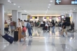 Touristes étrangers arrivant à l&#039;aéroport international I Gusti Ngurah Rai, Bali. ANTARA/HO-PT AP I (Persero).