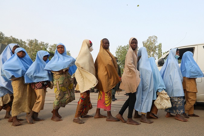 Girls who were kidnapped from a boarding school in the northwest Nigerian state of Zamfara, walk in line after their release in Zamfara, Nigeria March 2, 2021